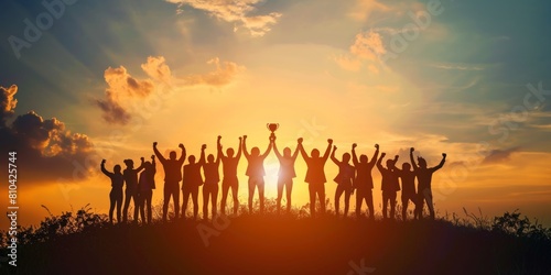 Silhouettes Winning team is holding trophy in hands.