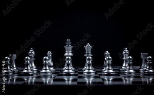 Chess board game in silver team show strategy game as business Challange competitive game ,chessboard this is business strategy plan concept with black background.