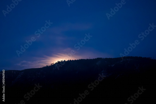 background moonrise over Catalina mountains Arizona