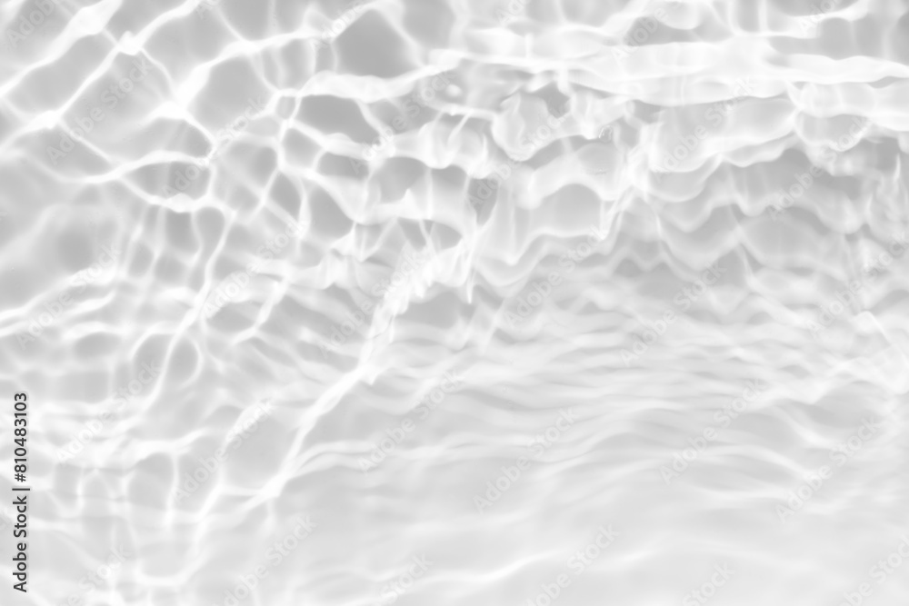 White water with ripples on the surface. Defocus blurred transparent white colored clear calm water surface texture with splashes and bubbles. Water waves with shining pattern texture background. White water with ripples on the surface. Defocus blurred transparent white colored clear calm water surface texture with splashes and bubbles. Water waves with shining pattern texture background.