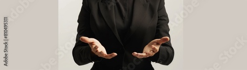 Construct an image of a female CEO wearing a formal black suit  torso visible  with hands gesturing openly