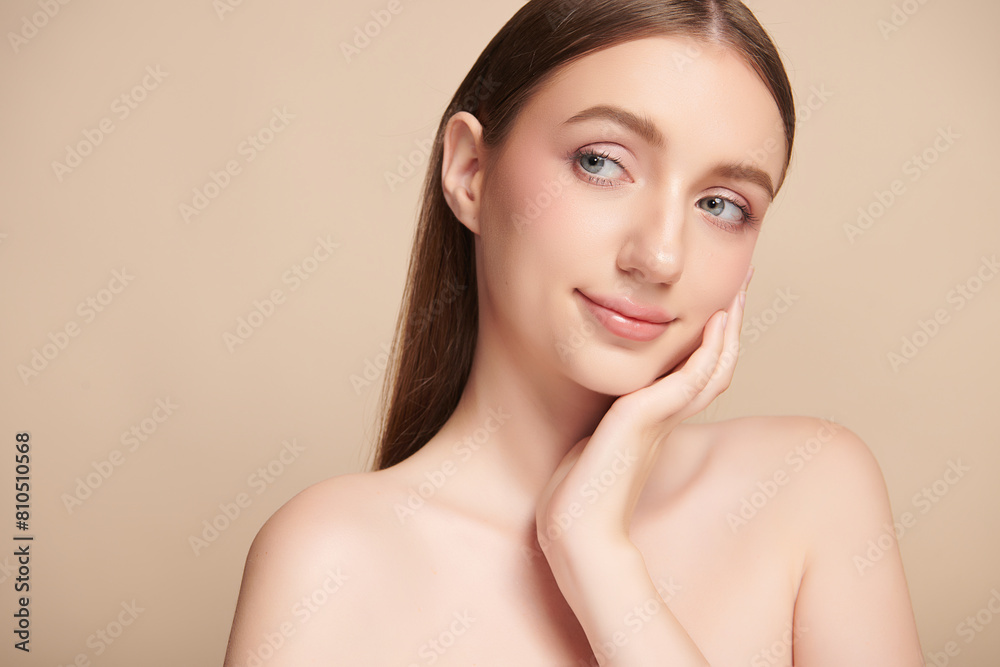 Beautiful young woman with clean fresh skin on beige background, Face care, Facial treatment, Cosmetology, beauty and spa, women portrait. Beautiful young woman with clean fresh skin on beige background, Face care, Facial treatment, Cosmetology, beauty and spa, women portrait.
