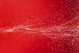 Swarms of tiny dots creating an emerging pattern on a solid red background.