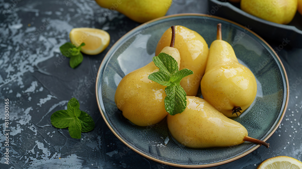 Plate with tasty cooked pears on table