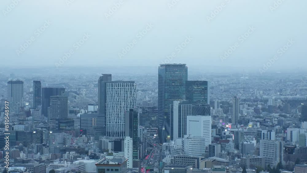 SHIBUYA, TOKYO, JAPAN - APRIL 2024 : Aerial high angle view of Shibuya city in sunset. View of tall buildings at busy downtown area. Time lapse shot. SHIBUYA, TOKYO, JAPAN - APRIL 2024 : Aerial high angle view of Shibuya city in sunset. View of tall buildings at busy downtown area. Time lapse shot.