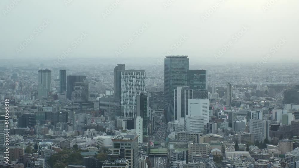 SHIBUYA, TOKYO, JAPAN - APRIL 2024 : Aerial high angle view of Shibuya city in sunset. View of tall buildings at busy downtown area. Time lapse shot. SHIBUYA, TOKYO, JAPAN - APRIL 2024 : Aerial high angle view of Shibuya city in sunset. View of tall buildings at busy downtown area. Time lapse shot.