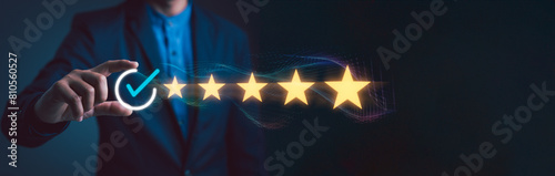 Businessman show high-quality assurance marks, good service, premium, five stars, excellent service, high quality, business excellence, premium service assurance. Quality Assurance Concepts