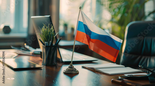 Russian flag stationery holder and laptop on table  photo