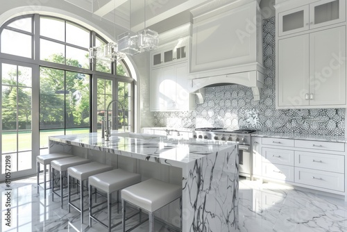White kitchen with a marble island and barstools in the center, large windows on the left side