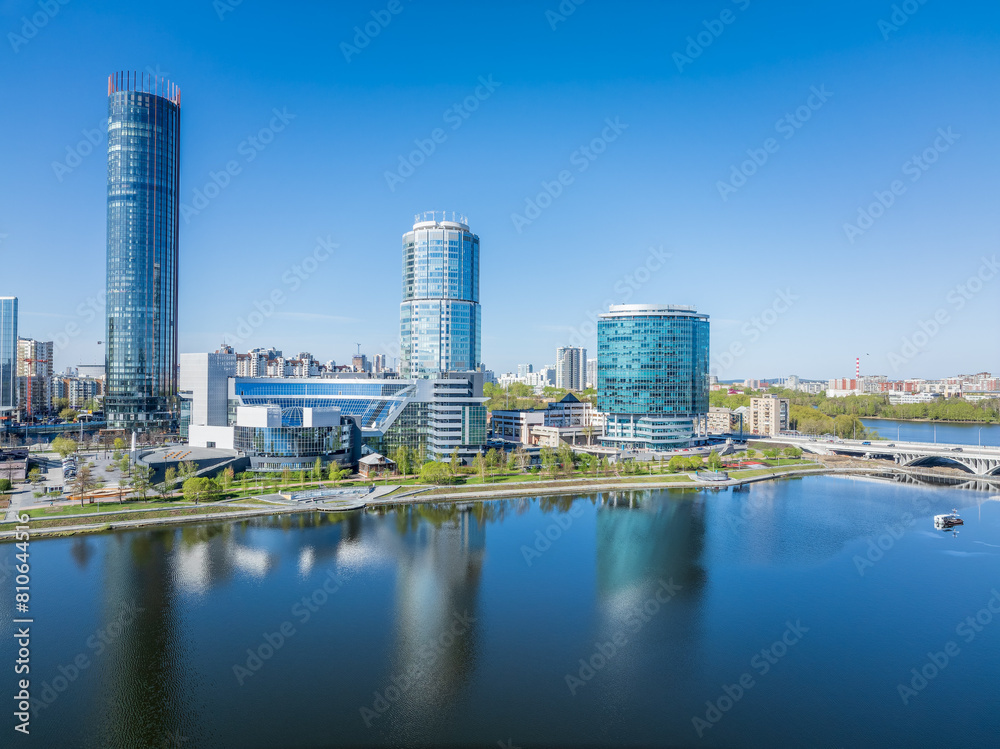 Fototapeta premium Yekaterinburg city with Buildings of Regional Government and Parliament, Dramatic Theatre, Iset Tower, Yeltsin Center, panoramic view at summer sunset.