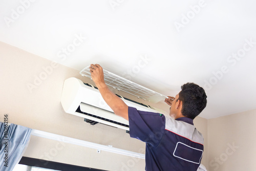 Technician man service for cleaning air conditioner, Repairman washing dirty compartments air conditioning, Maintenance and service concepts photo