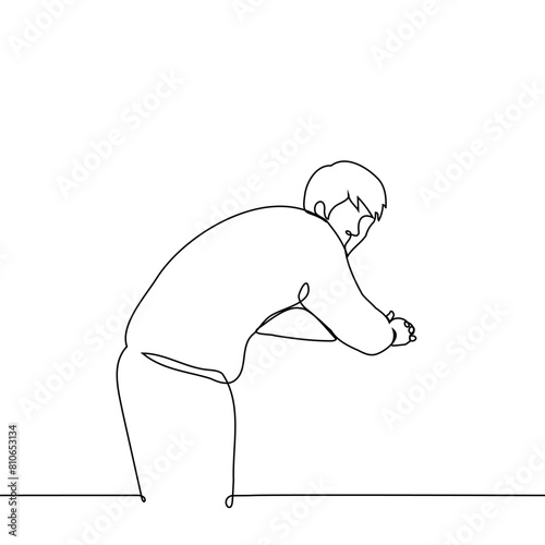 man stands leaning forward leaning on crossed elbows and turned around and looks at the camera - one line art vector. concept lonely man standing, hunched back	