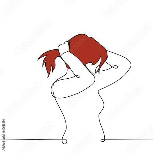 woman collects her hair on the back of head in a ponytail - one line art vector. concept long-haired woman doing ponytail photo