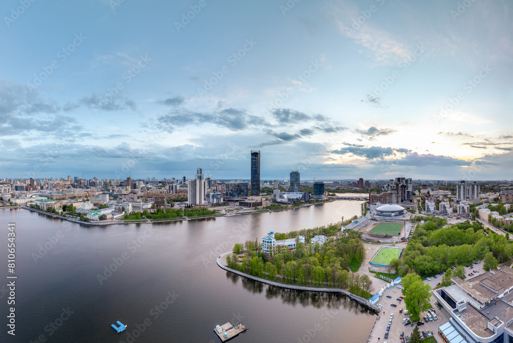 Obraz premium Yekaterinburg city with Buildings of Regional Government and Parliament, Dramatic Theatre, Iset Tower, Yeltsin Center, panoramic view at summer sunset.