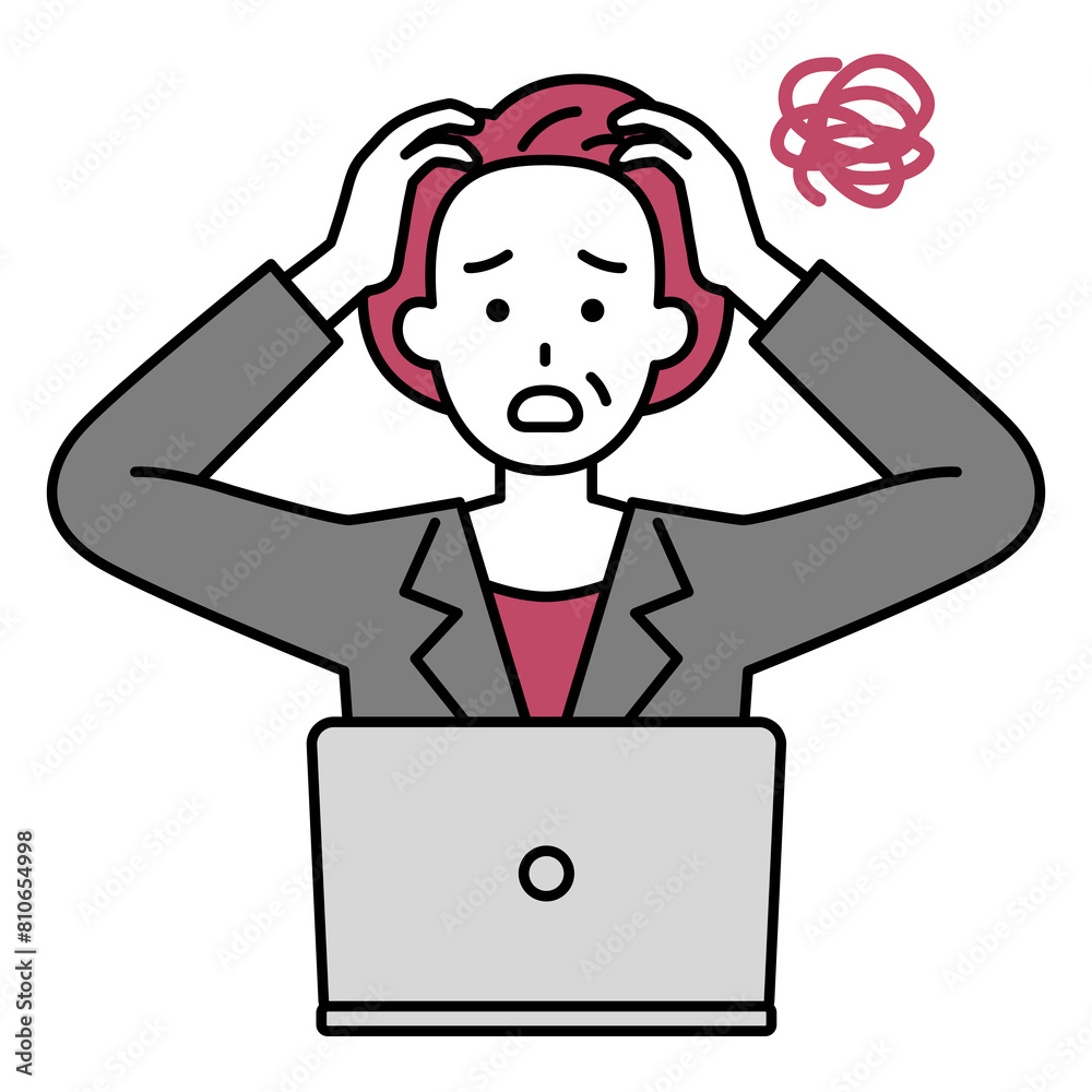 困惑するノートパソコンで仕事をする年配のスーツの女性