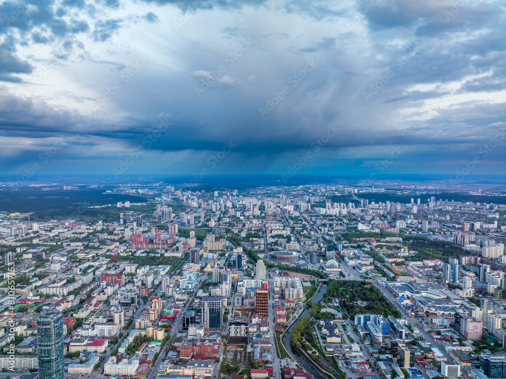 Yekaterinburg aerial panoramic view in summer sunset. Ekaterinburg is the fourth largest city in Russia located in the Eurasian continent on the border of Europe and Asia. Yekaterinburg aerial panoramic view in summer sunset. Ekaterinburg is the fourth largest city in Russia located in the Eurasian continent on the border of Europe and Asia.