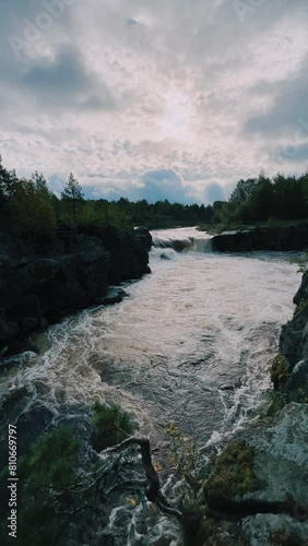 Voytsky padun waterfall in autumn. The famous powerful and wide Karelian waterfall Voytsky Padun is surrounded by rocks and greenery. Cascading waterfall on the river. Karelia, Russia 4K photo