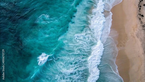 Aerial view of the beach with waves, captured from above by an iPhone camera, showcasing the vastness and beauty of nature's creation.