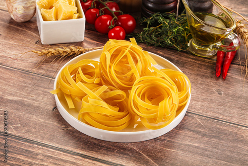 Raw dry Italian pasta - pappardelle