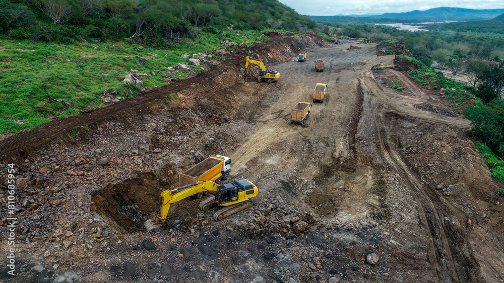 Grader, Excavator, and Dump Trucks Preparing Construction Site Grader, Excavator, and Dump Trucks Preparing Construction Site