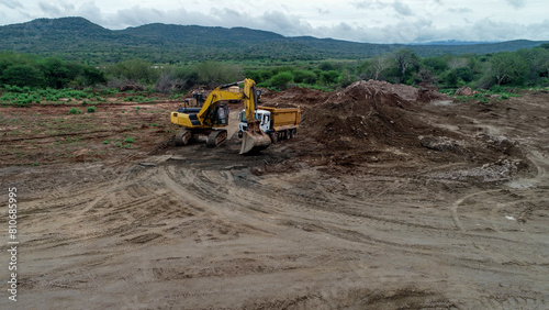 excavator and dump truck  (ID: 810685995)