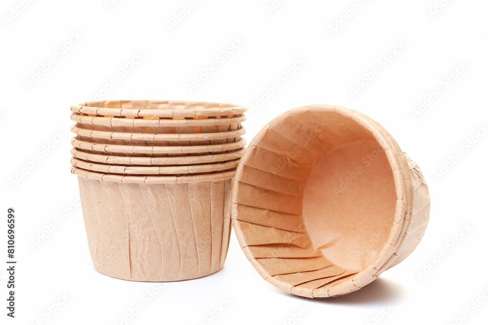Paper cups for cupcakes or muffins on white background Paper cups for cupcakes or muffins on white background