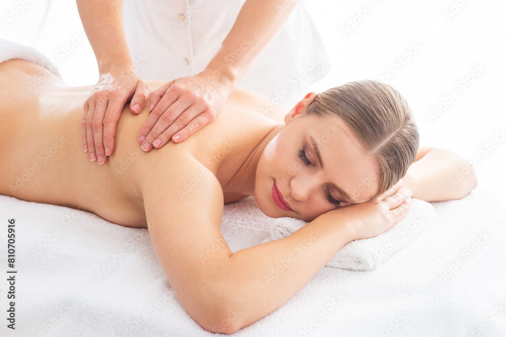 Young woman getting massaging treatment over white. Spa, healthcare and recreation concept. Young woman getting massaging treatment over white. Spa, healthcare and recreation concept.