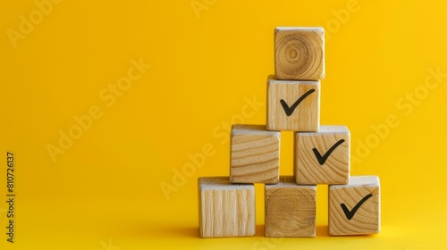 Stack of wooden blocks with check marks against bright background. Building blocks of success on vibrant background