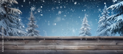A winter themed wooden background for Christmas featuring a snow covered fir tree The composition provides ample space for additional elements