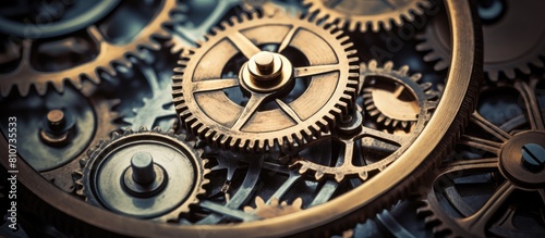 Close up of intricate worn gears in an antique mechanism perfect for a copy space image
