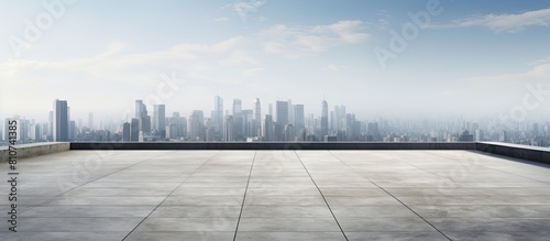 Empty concrete square surrounded by a panoramic skyline and buildings perfect for a copy space image