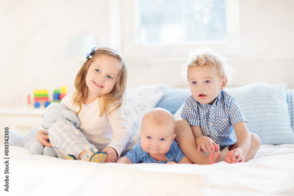 Kids in bed. Children in pajamas. Family bedroom. Kids in bed. Children in pajamas. Family bedroom.
