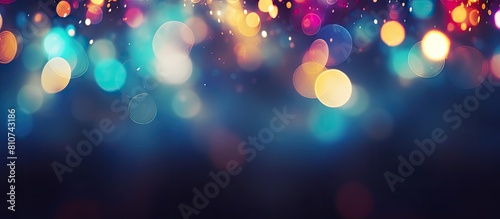Festive lights with a blurry view set against a black backdrop creating a bokeh effect and leaving room for text. Creative banner. Copyspace image