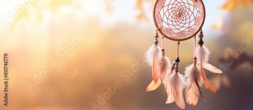 Close up copy space image of a magical and ritual Dreamcatcher a spiritual amulet designed to hang in the wind during springtime ensuring good dreams photo