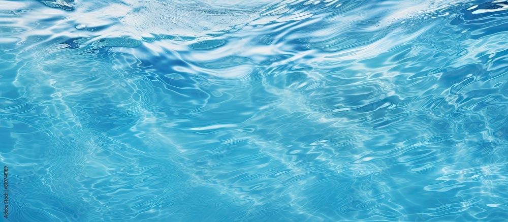 A high resolution background image of a swimming pool filled with water featuring a textured abstract or rippling wave pattern. Creative banner. Copyspace image