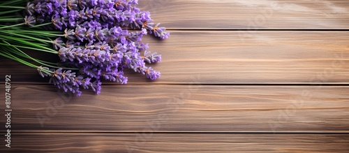 A top down view of fresh lavender bouquet with wood as the background creates a captivating copy space image