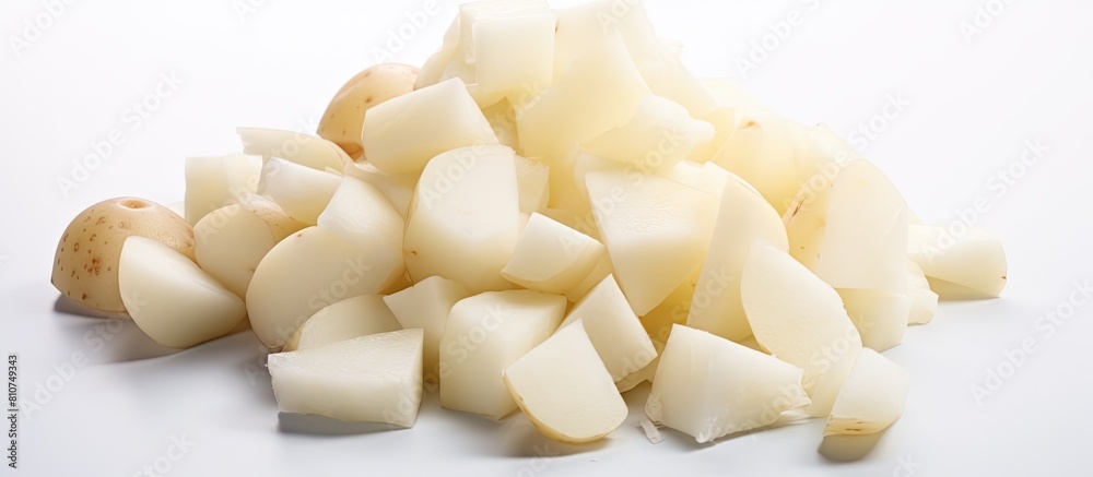 A copy space image of white isolated raw peeled potatoes A copy space image of white isolated raw peeled potatoes