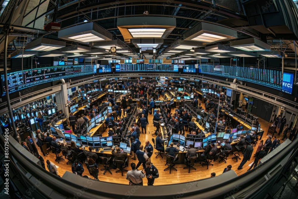 A large room is filled with numerous computers as traders engage in transactions during a busy trading session