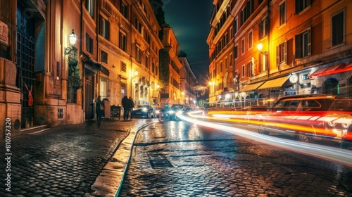 A motion blurred street at night  with light streaks and cars driving fast  