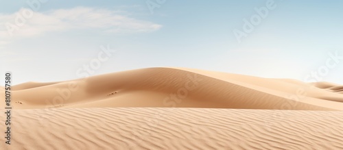 A copy space image with a backdrop of smooth sand