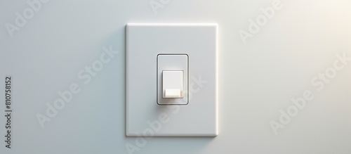 Close up of a white plastic light switch mounted on a light gray wall The image features ample copy space