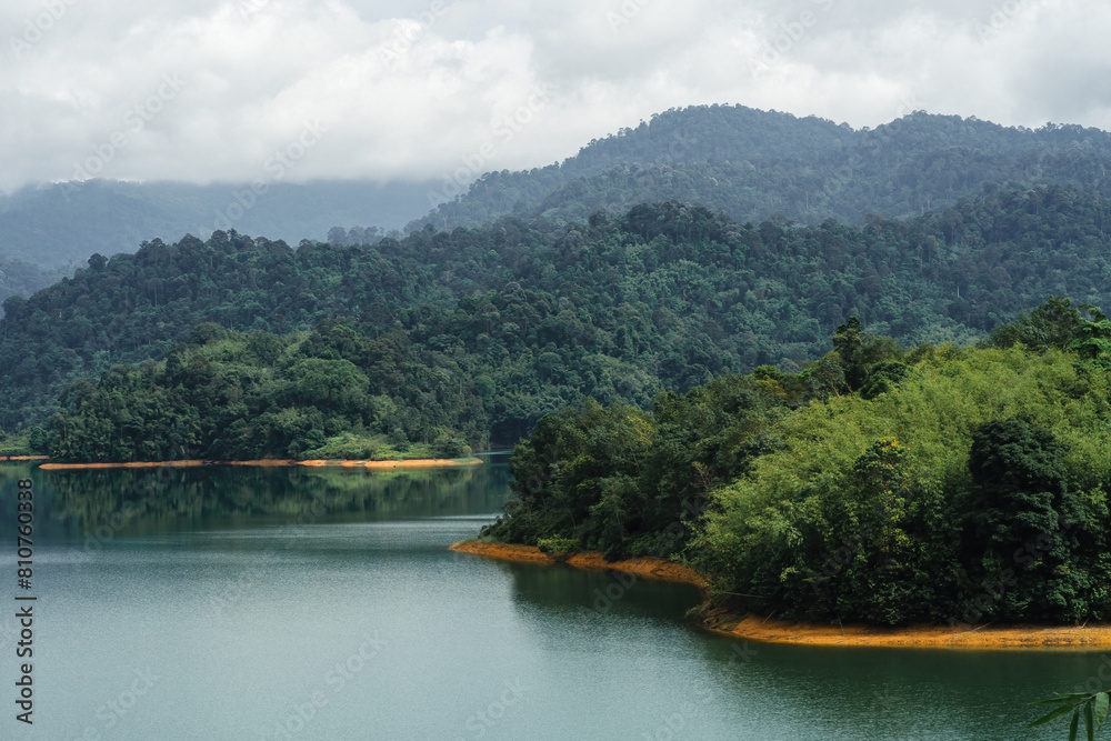 Kuala Kubu Bharu, Malaysia, features tropical trees and a green lake.