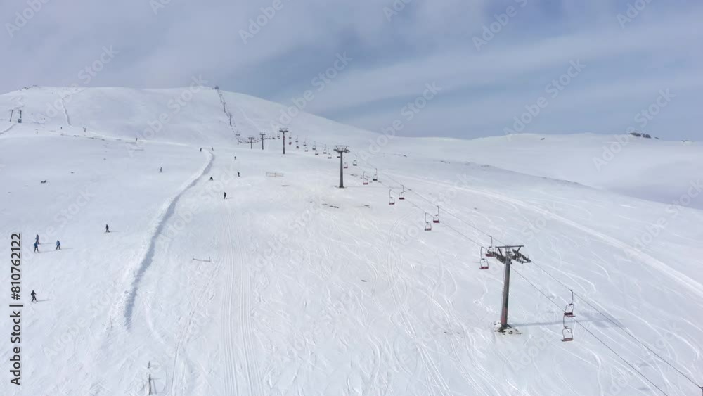 Drone view of skiers skiing downhill in the slopes in the scenic Mountain Kaimaktsalan Greece winter day Drone view of skiers skiing downhill in the slopes in the scenic Mountain Kaimaktsalan Greece winter day