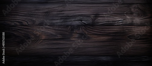 Close up of a dark wood texture creating an abstract background with copy space image