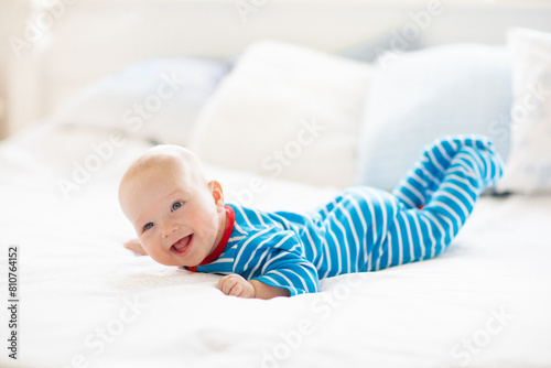 Little baby on white bed