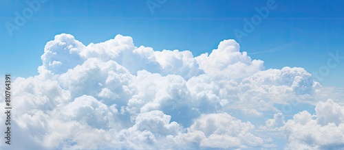 After the rain a serene blue sky adorned with fluffy white clouds. Creative banner. Copyspace image