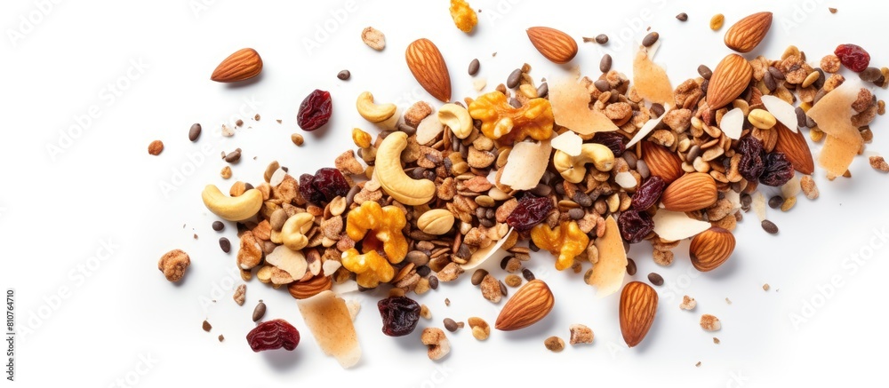 Top view of a homemade granola with a variety of nuts and seeds spread on a baking sheet Perfect as a healthy breakfast option with a white background and enough space for additional images or text Top view of a homemade granola with a variety of nuts and seeds spread on a baking sheet Perfect as a healthy breakfast option with a white background and enough space for additional images or text
