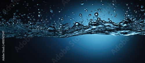 A copy space image showcases refreshing blue water droplets splashing onto a black backdrop symbolizing the concept of a drink that is fresh and rejuvenating It represents the rain as a source of pur