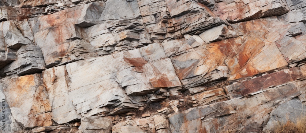 A close up view of a rocky cliff with natural stones in various colors providing a volumetric rock background The image includes copy space for your design A close up view of a rocky cliff with natural stones in various colors providing a volumetric rock background The image includes copy space for your design