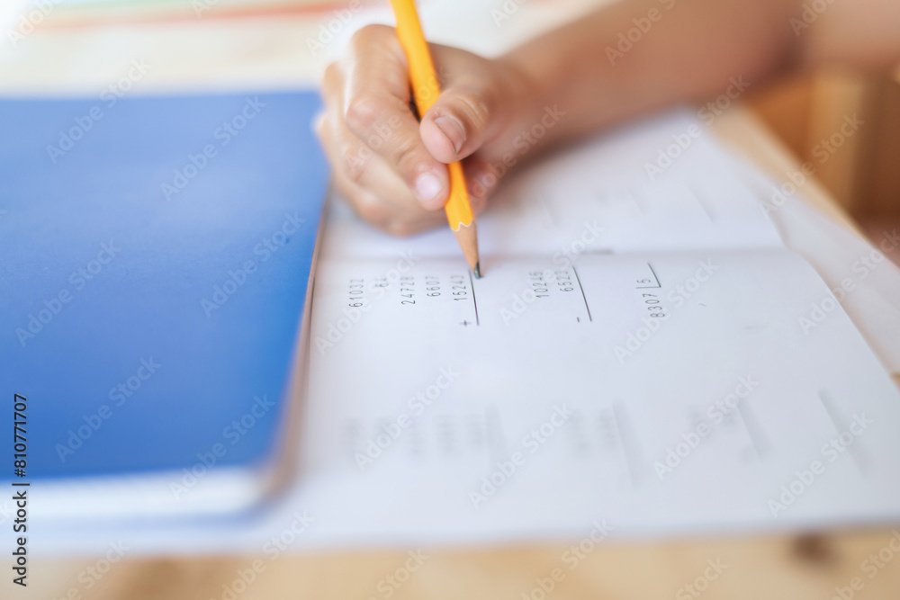 Close-Up Of A 9 Year Old Boy Using A Pencil Doing Math Exercises. Childhood Education. Close-Up Of A 9 Year Old Boy Using A Pencil Doing Math Exercises. Childhood Education.